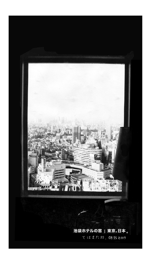 The Tokyo’s urban skyline through the glass window at Ikebukuro hotel